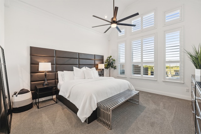 carpeted bedroom with ceiling fan, ornamental molding, and high vaulted ceiling