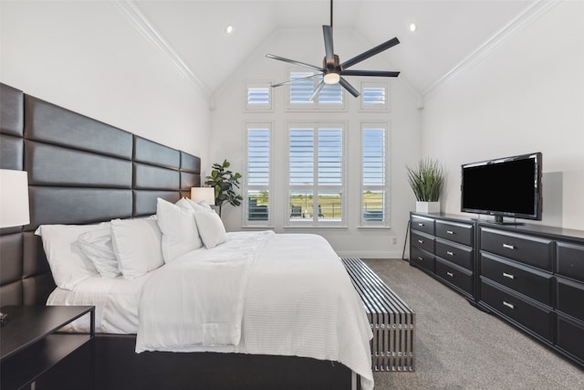 carpeted bedroom with ceiling fan, ornamental molding, and high vaulted ceiling