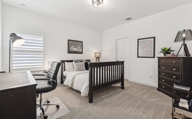 bedroom featuring light carpet, visible vents, and baseboards