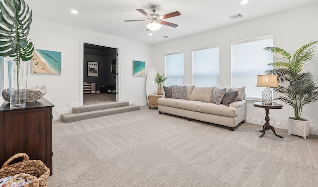 living room with light carpet, baseboards, visible vents, and recessed lighting