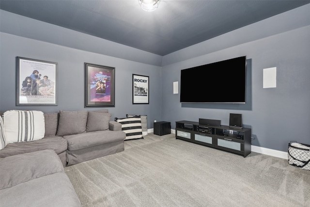 living room featuring light colored carpet and baseboards