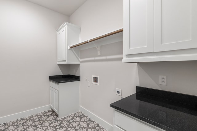 laundry area with cabinet space, baseboards, hookup for a washing machine, light floors, and electric dryer hookup