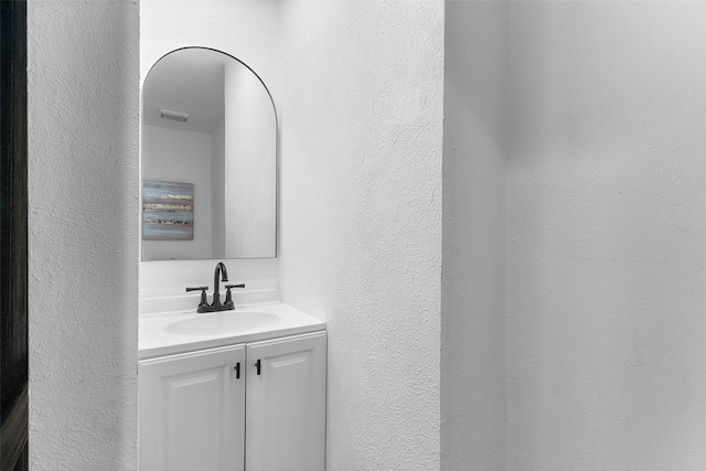 912 Glen Oaks Blvd, Dallas, TX 75232 - bathroom featuring a textured wall and vanity