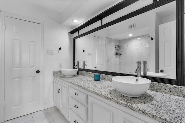 912 Glen Oaks Blvd, Dallas, TX 75232 - full bath with double vanity, marble finish flooring, and a marble finish shower