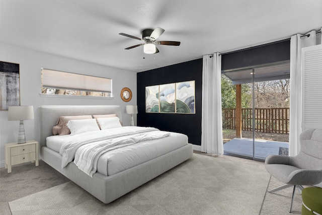 bedroom with access to exterior, carpet, baseboards, and a ceiling fan