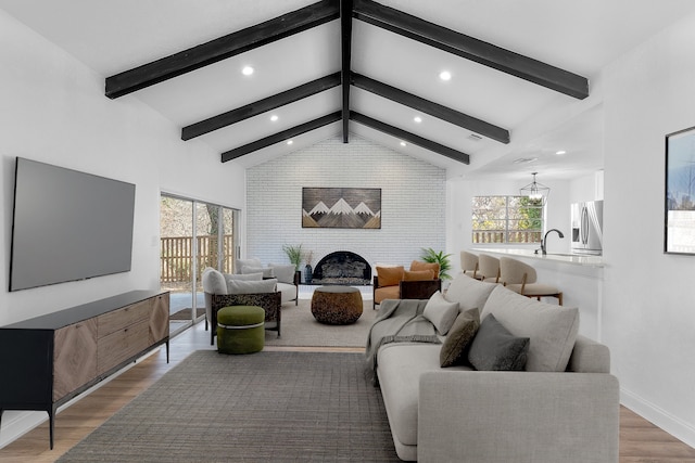 912 Glen Oaks Blvd, Dallas, TX 75232 - living area with wood finished floors, recessed lighting, and a brick fireplace