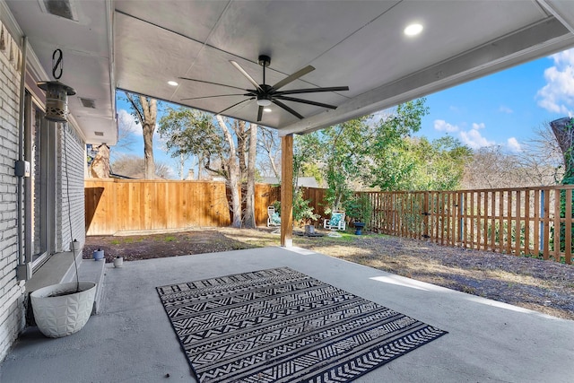 view of patio featuring ceiling fan