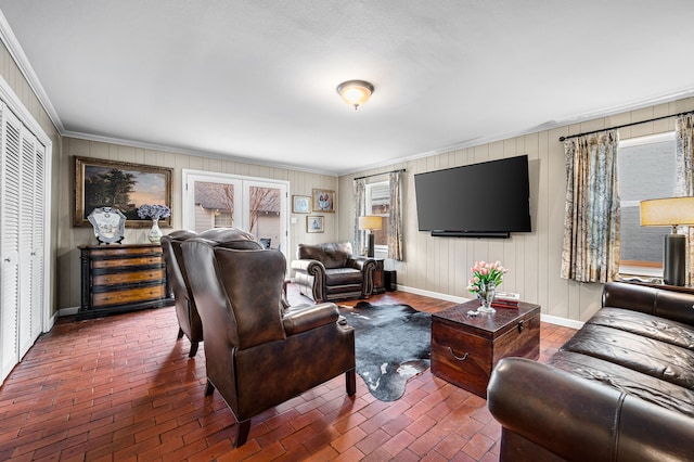 living room featuring ornamental molding and a healthy amount of sunlight