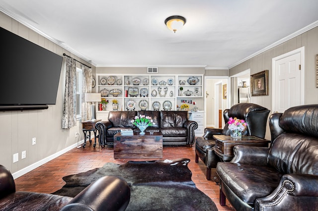 living room featuring built in shelves and crown molding