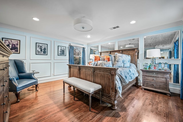 bedroom featuring ornamental molding and hardwood / wood-style floors