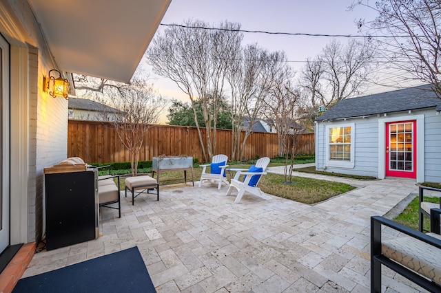 patio terrace at dusk with an outbuilding