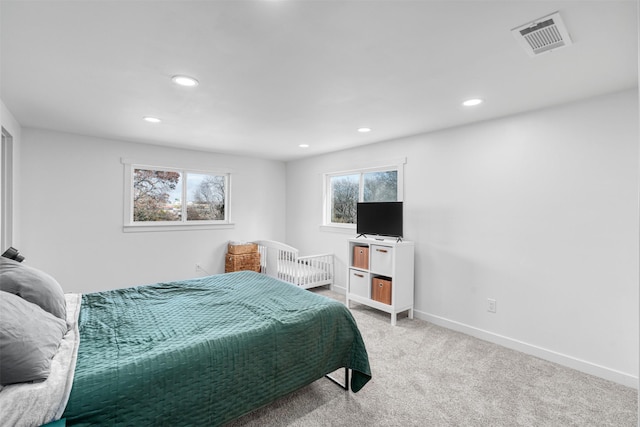 bedroom featuring light carpet