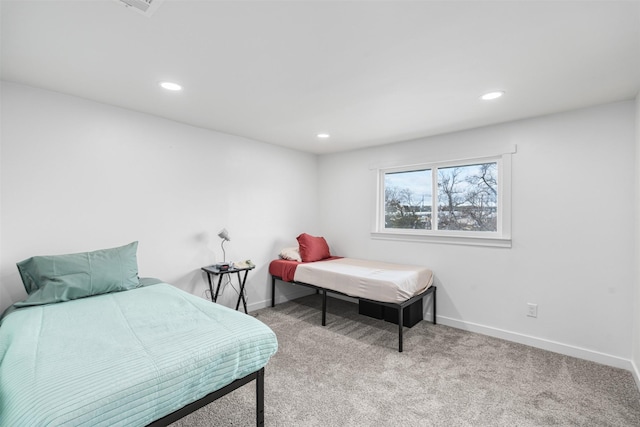 bedroom with light colored carpet