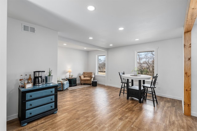 dining space featuring wood-type flooring