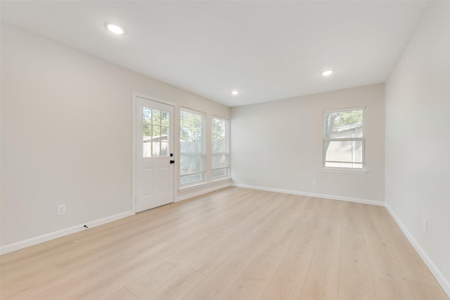 unfurnished room featuring light hardwood / wood-style flooring