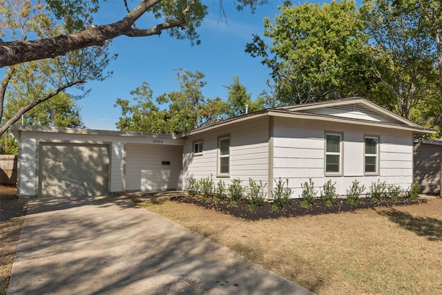 ranch-style home featuring a garage