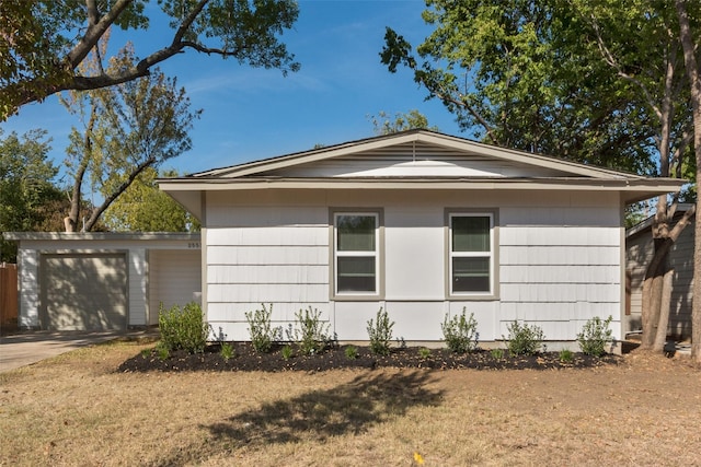 view of side of home featuring a lawn