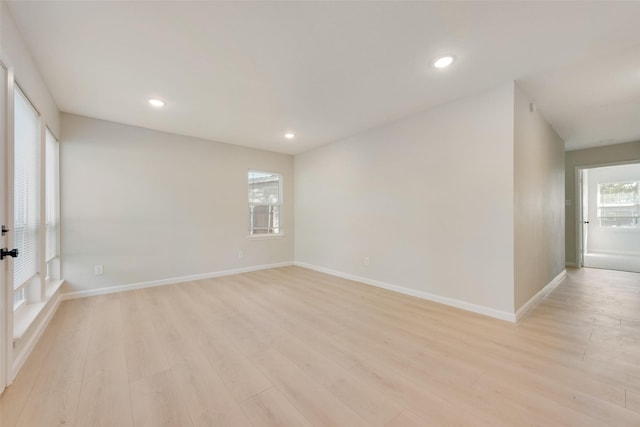 unfurnished room featuring light wood-type flooring