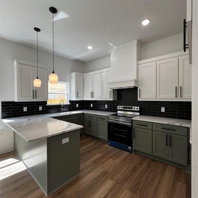 kitchen with electric stove, kitchen peninsula, sink, custom range hood, and white cabinets