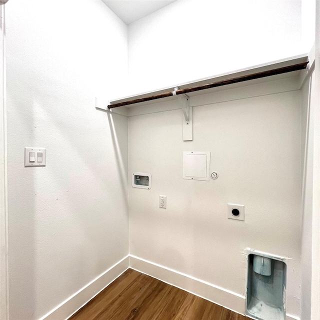 clothes washing area with gas dryer hookup, dark wood-type flooring, washer hookup, and electric dryer hookup