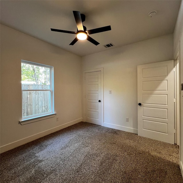 unfurnished bedroom with ceiling fan and carpet floors