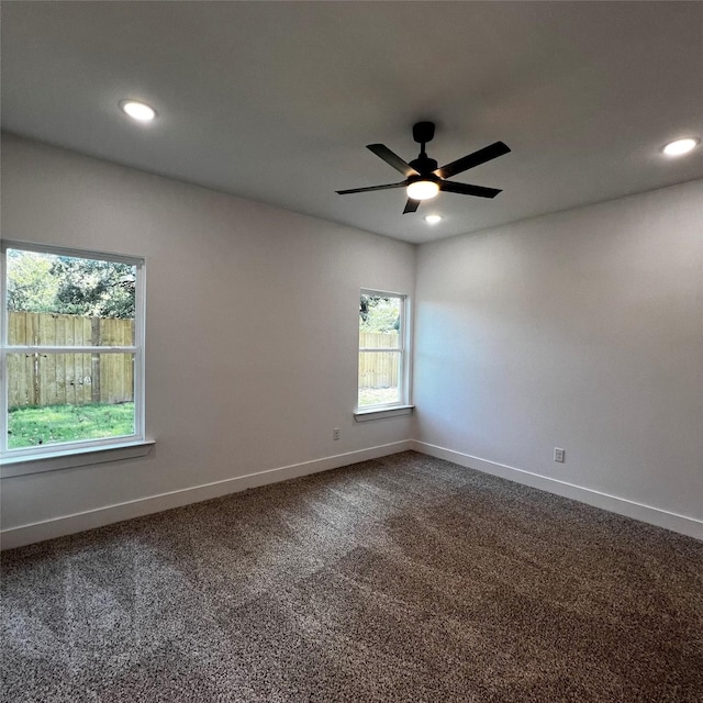 empty room featuring ceiling fan and carpet flooring