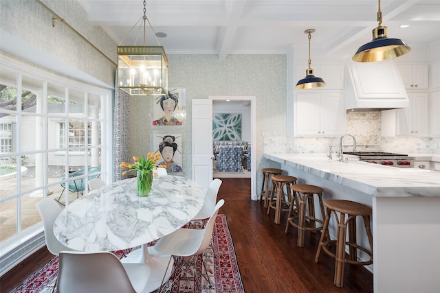 dining room featuring dark hardwood / wood-style flooring, beam ceiling, and coffered ceiling