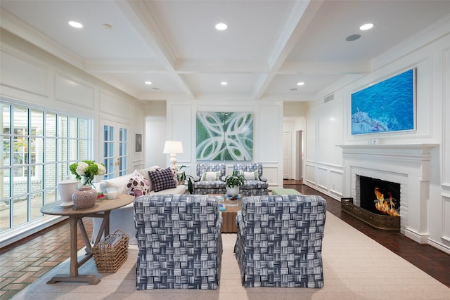 living room with hardwood / wood-style floors, ornamental molding, beam ceiling, and coffered ceiling