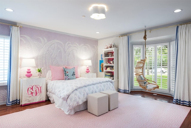 bedroom featuring hardwood / wood-style flooring and ornamental molding