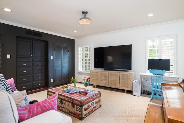 living room with ornamental molding and light colored carpet