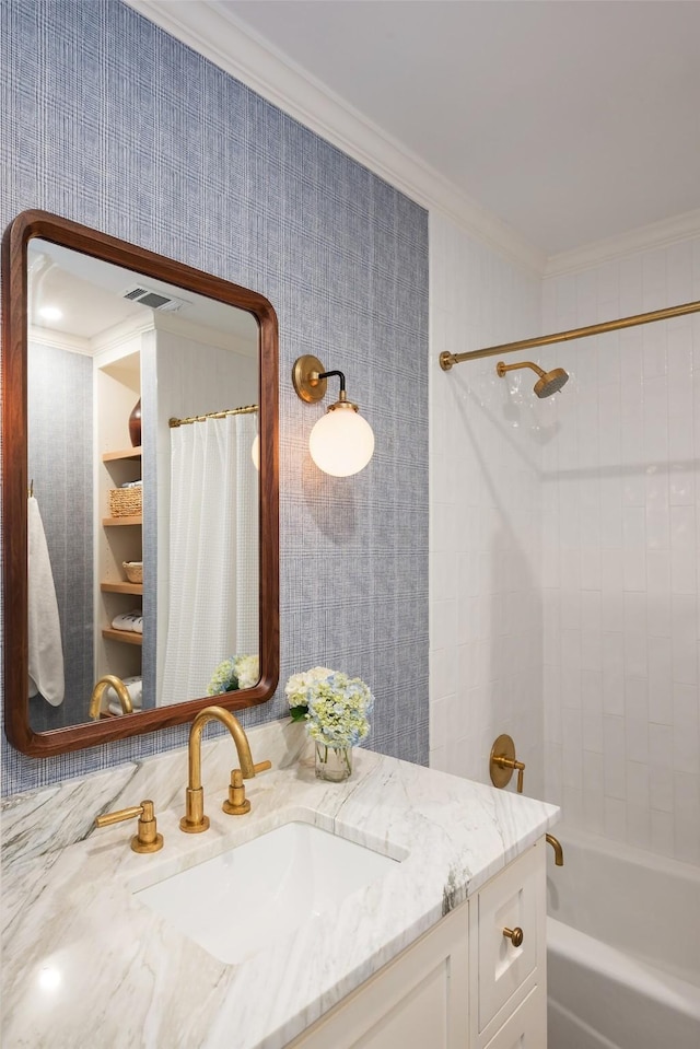 bathroom featuring vanity, shower / tub combo with curtain, and ornamental molding