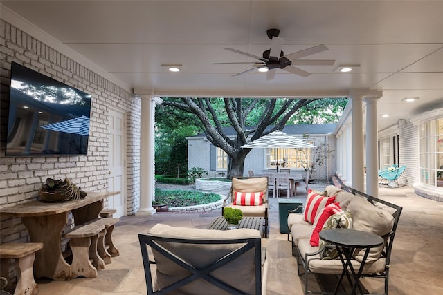 view of patio / terrace with ceiling fan and outdoor lounge area