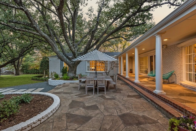 view of patio terrace at dusk