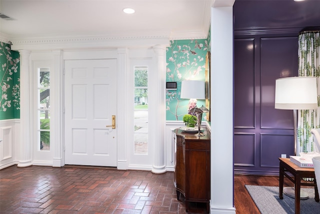 foyer entrance featuring ornamental molding