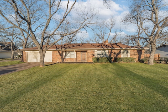 ranch-style house with a garage and a front lawn