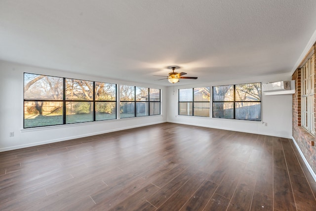 interior space featuring a wall mounted air conditioner and ceiling fan