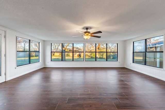 unfurnished room featuring ceiling fan and dark hardwood / wood-style flooring