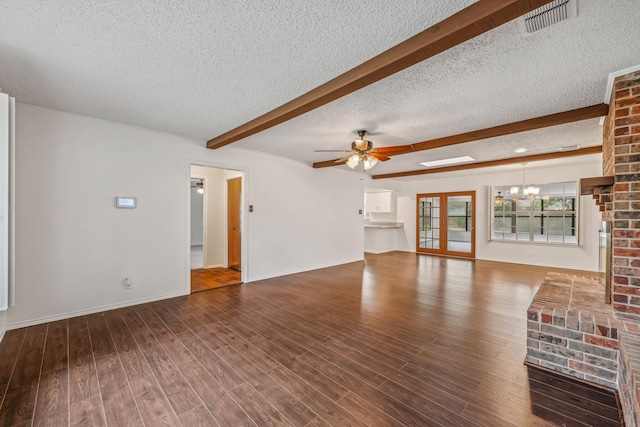 unfurnished living room featuring beamed ceiling, hardwood / wood-style flooring, ceiling fan with notable chandelier, and a textured ceiling