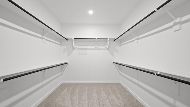 740 Vineyard Way, Forney, TX 75126 - walk in closet featuring light colored carpet