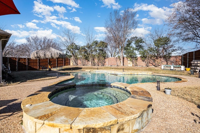 view of pool featuring an in ground hot tub