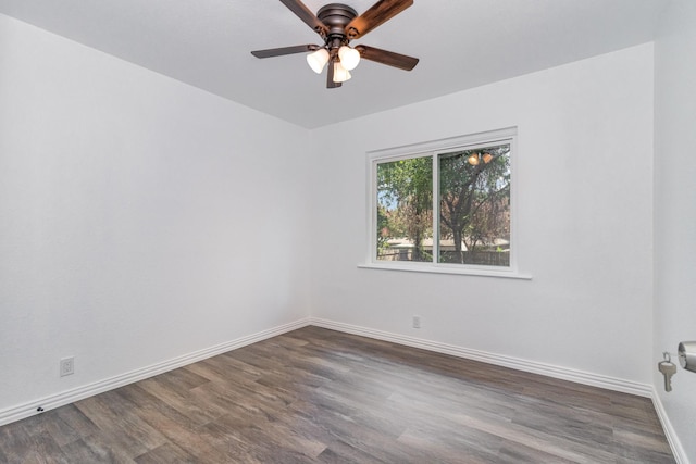 unfurnished room featuring ceiling fan and dark wood-type flooring