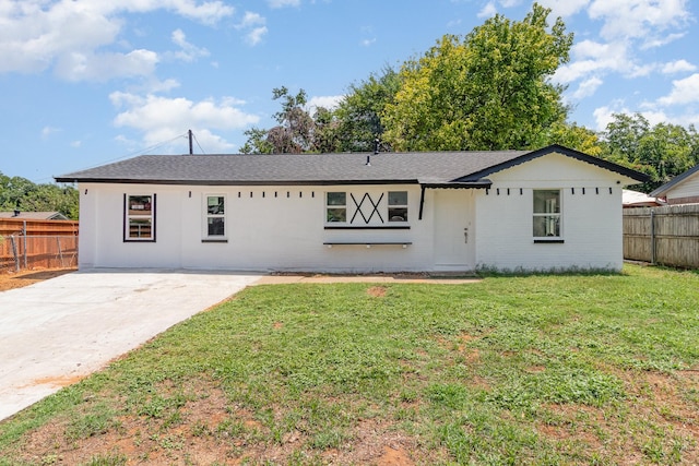 ranch-style house with a front lawn