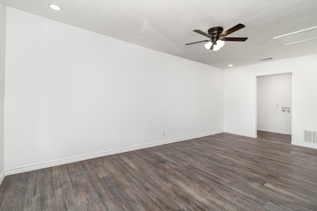 unfurnished room with a textured ceiling, ceiling fan, and dark hardwood / wood-style flooring