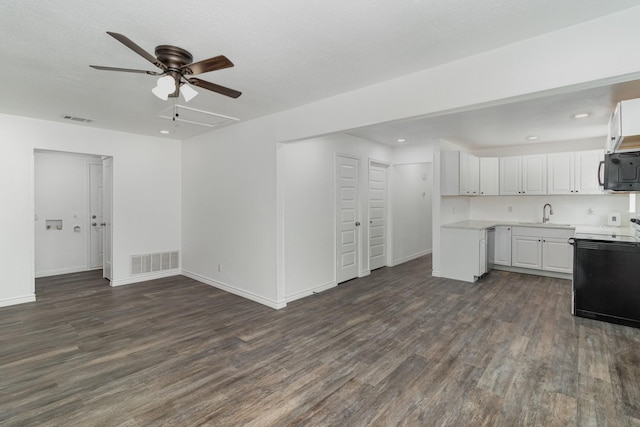 kitchen featuring white cabinetry, ceiling fan, electric stove, dark hardwood / wood-style flooring, and sink