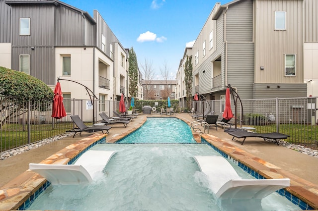 4211 Rawlins St Unit 733, Dallas, TX 75219 - community pool featuring a patio area and a residential view