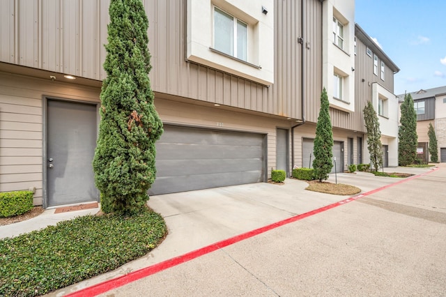 4211 Rawlins St Unit 733, Dallas, TX 75219 - view of front of house with concrete driveway and an attached garage