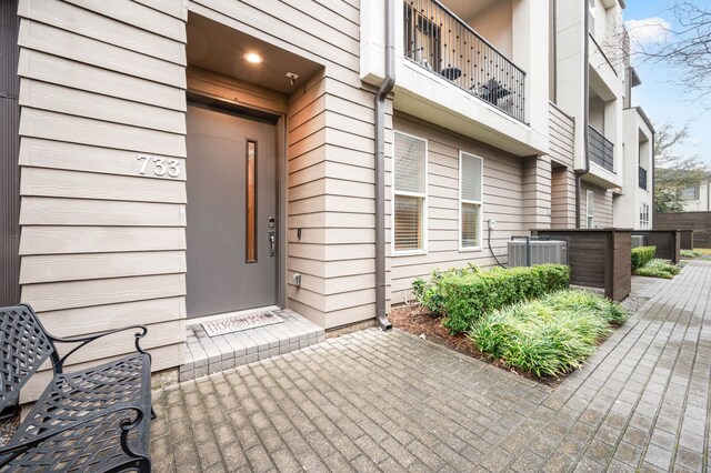 4211 Rawlins St Unit 733, Dallas, TX 75219 - doorway to property with central air condition unit