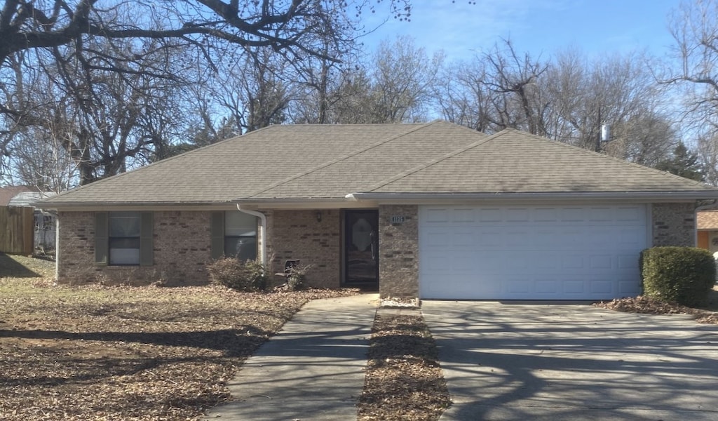 ranch-style home with a garage