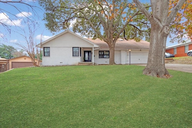 single story home featuring a front lawn and a garage