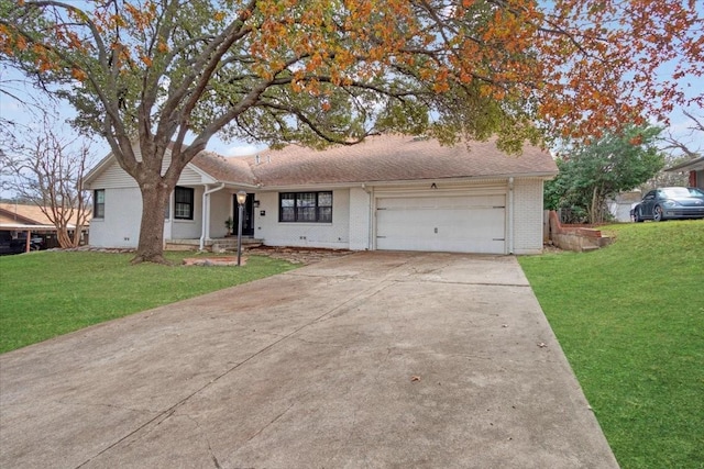 ranch-style home with a garage and a front yard